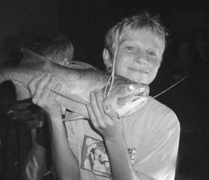 Sam Glasgow looks pleased with this night-time session threadfin salmon. 